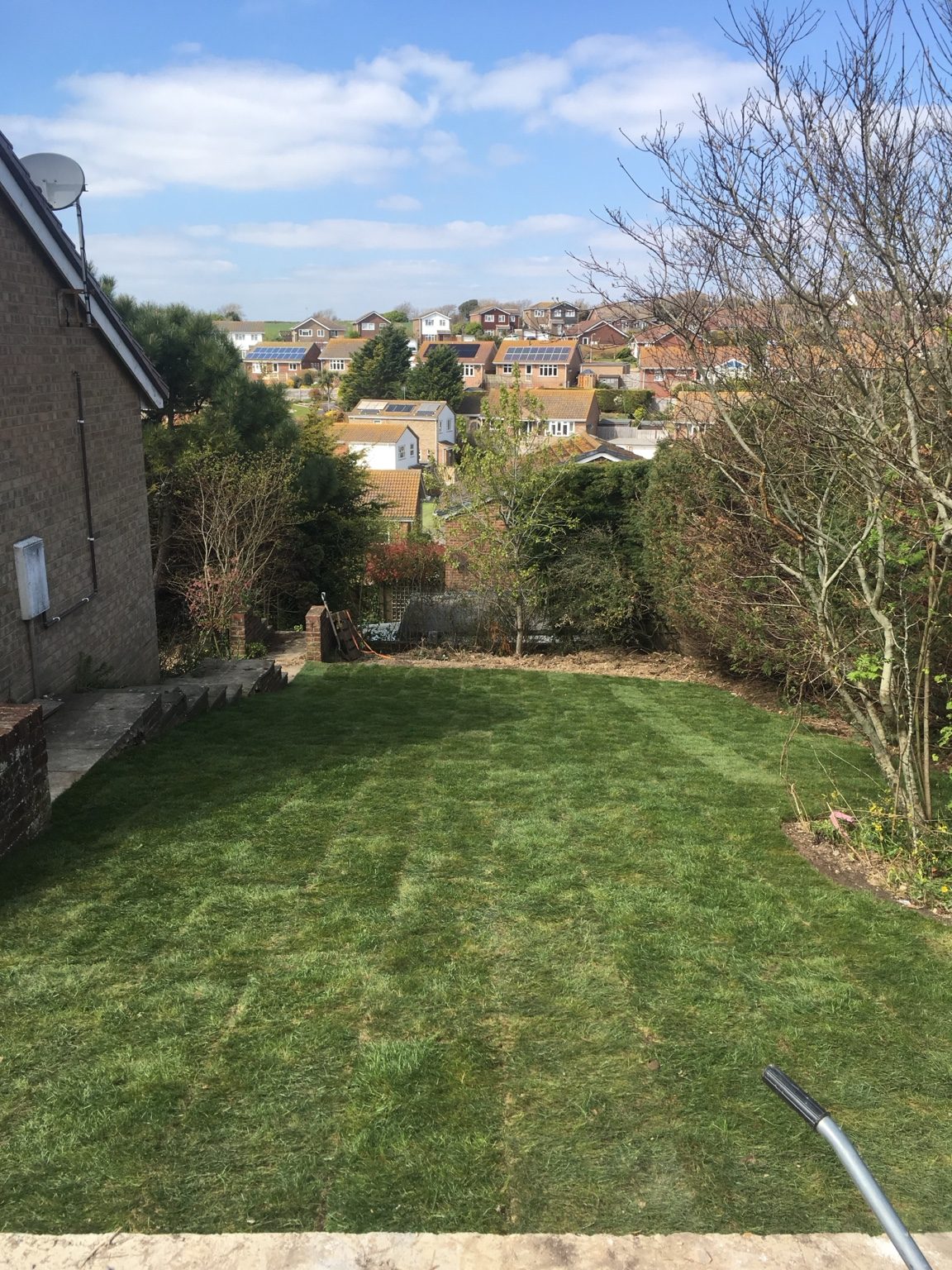 Completed lawn on a sloped garden